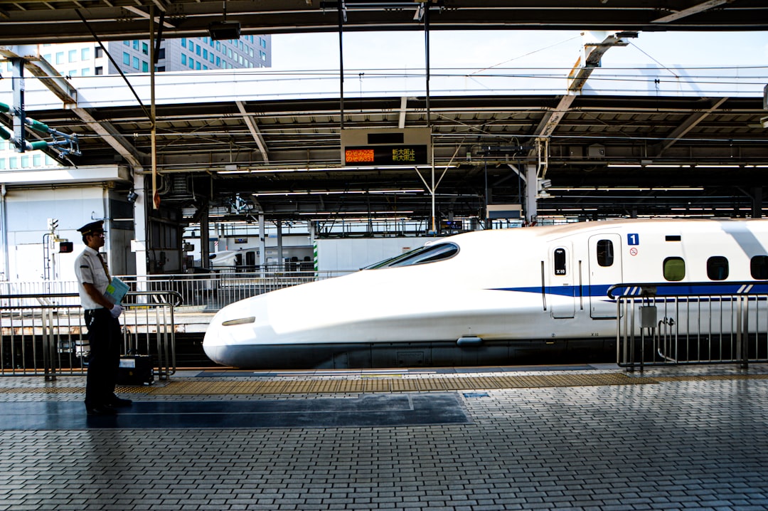 Shinkansen at a Japanese station platform for intercity luggage planning