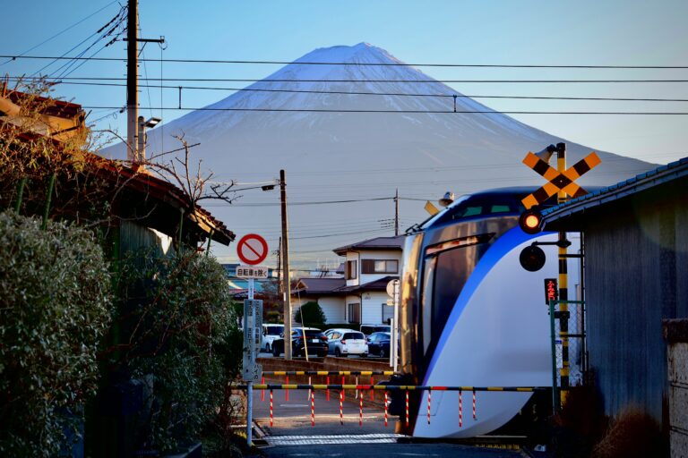 Train traveling near Mount Fuji, representing rail travel from Tokyo to Kawaguchiko