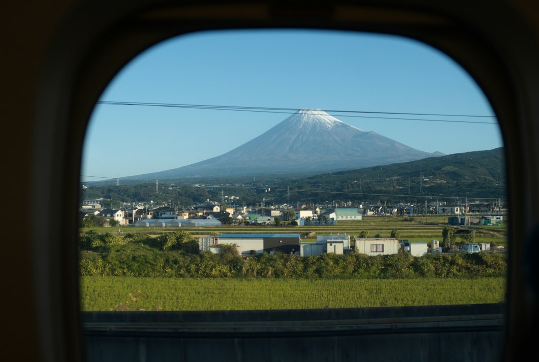 Mount Fuji viewed from a train window during rail travel in Japan