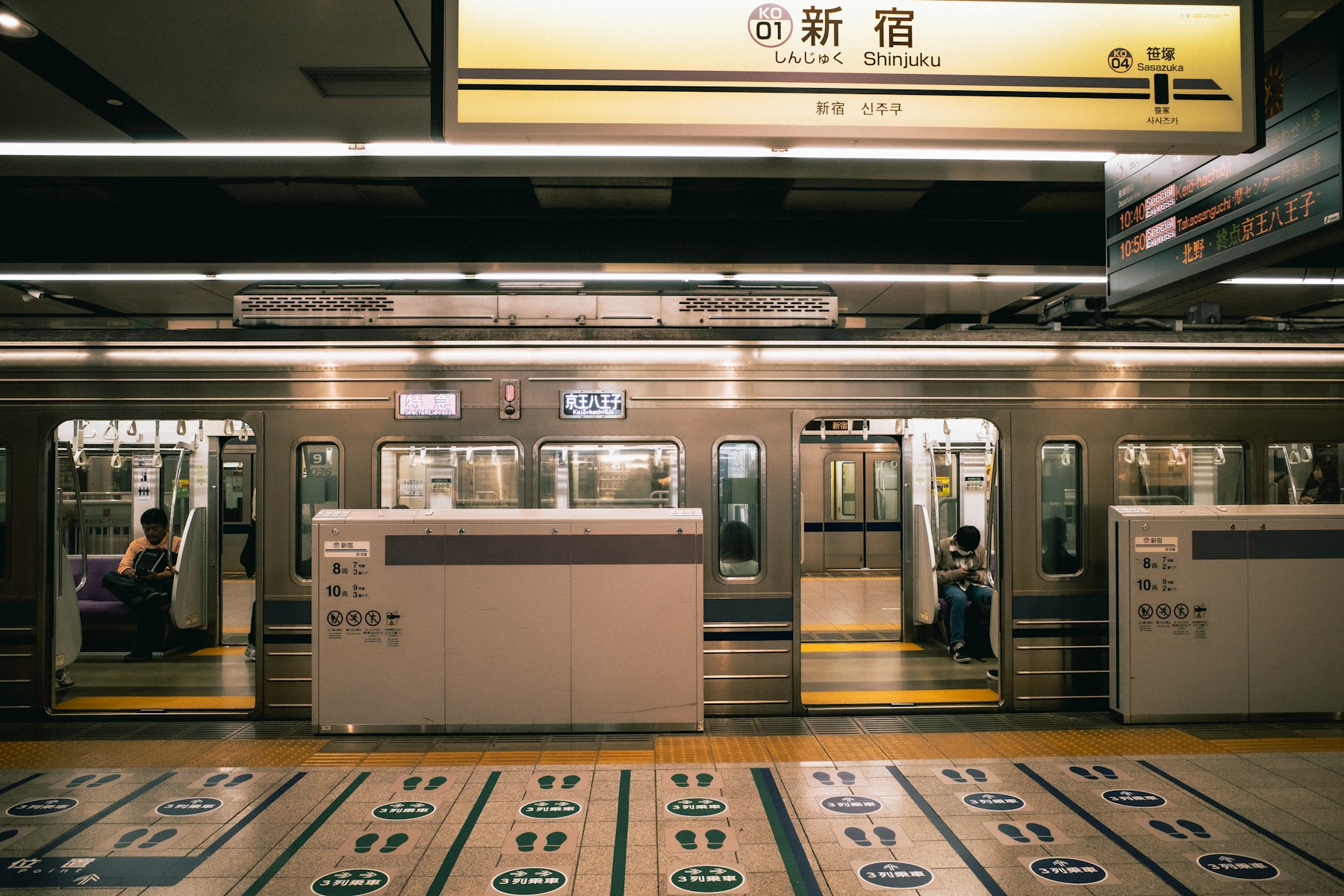 Passengers waiting on a Tokyo Metro station platform