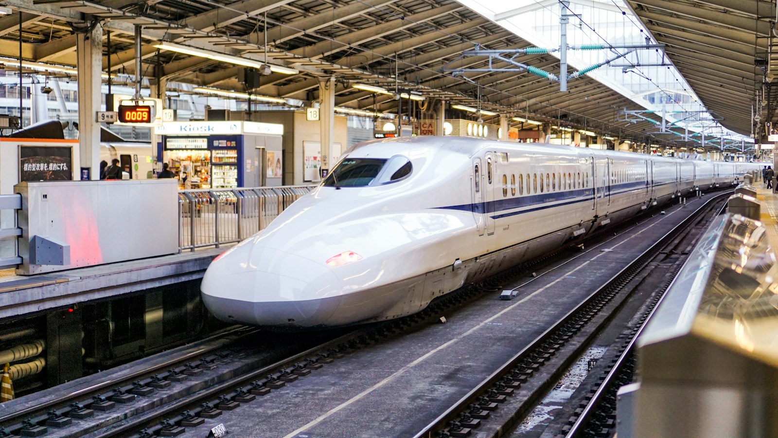 White Shinkansen arriving at a platform at Tokyo Station