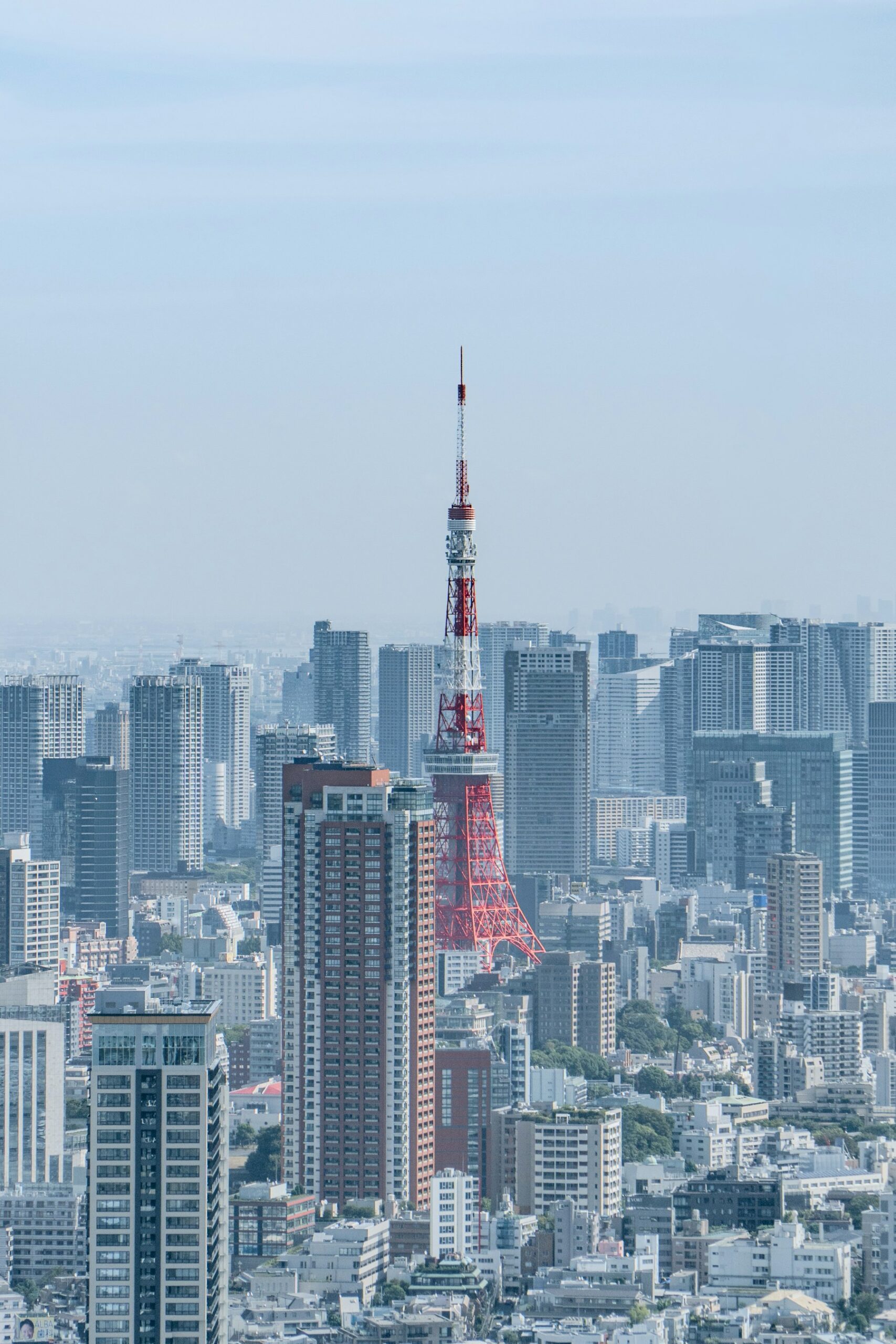 Tokyo Tower rising above the dense Tokyo skyline.